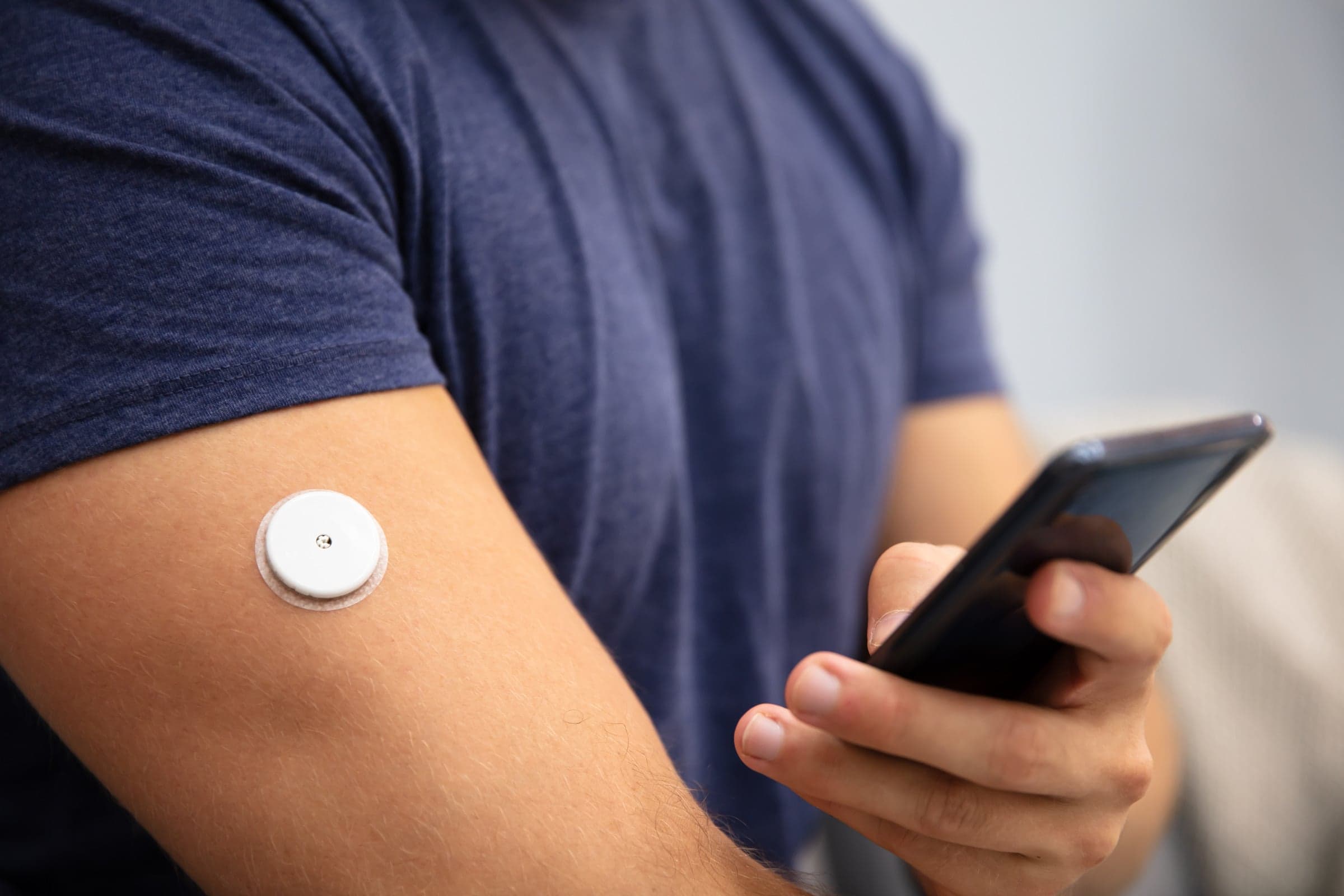 A continuous glucose monitor worn on the arm